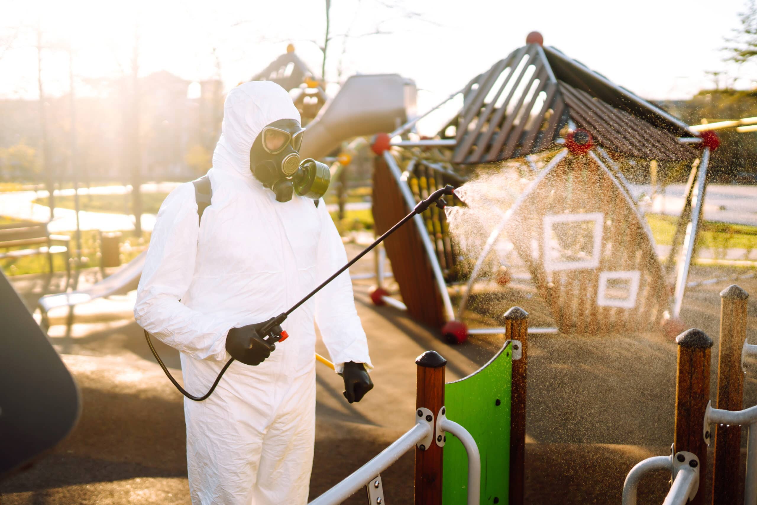 man-wearing-protective-suit-disinfecting-the-playg-2025-03-08-21-38-37-utc-scaled